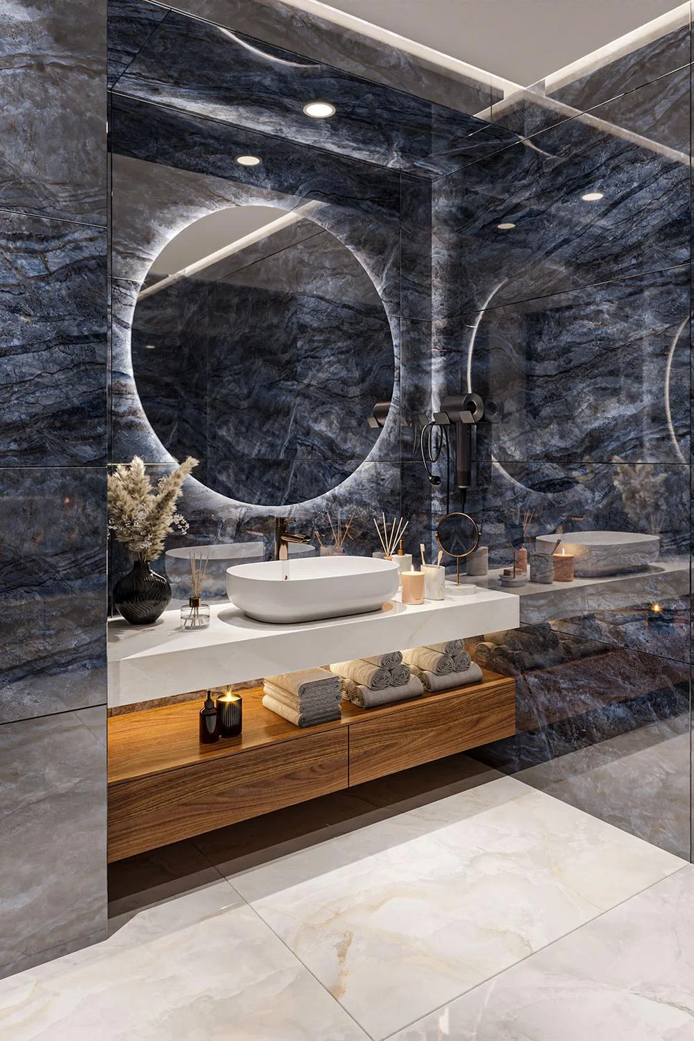 Modern bathroom with dark marble walls, white quartz countertop, and illuminated circular mirrors